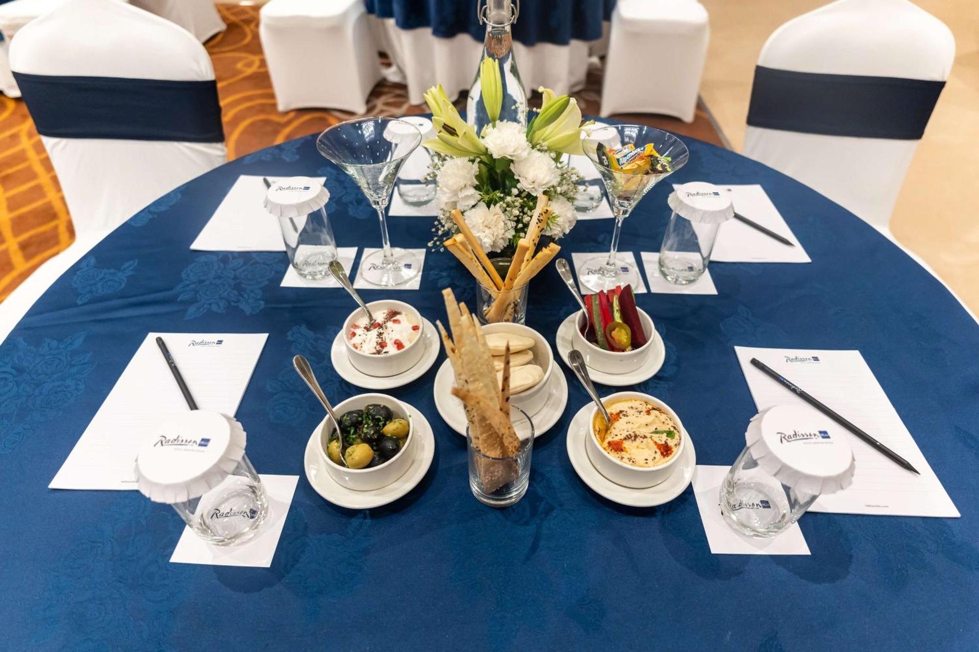 Radisson Blu Hotel, Greater Noida Kültér fotó A table set for a meeting